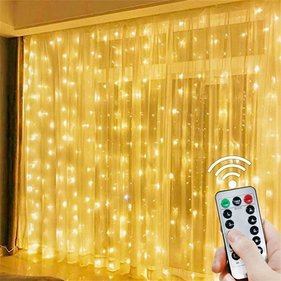 A hand holds a remote control next to a bright yellow LED curtain string light illuminating a window.
