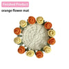 Finished orange flower mat made of hand-crocheted roses in various shades of orange and cream.