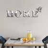 Decorative wall art featuring the word HOME spelled out in mirrored letters with butterfly accents