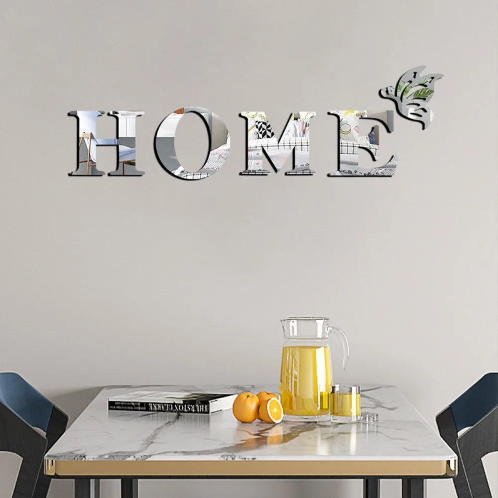 Decorative wall art featuring the word HOME spelled out in mirrored letters with butterfly accents