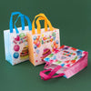 A set of reusable happy birthday gift bags in various colors and designs, including pink, orange, and blue.