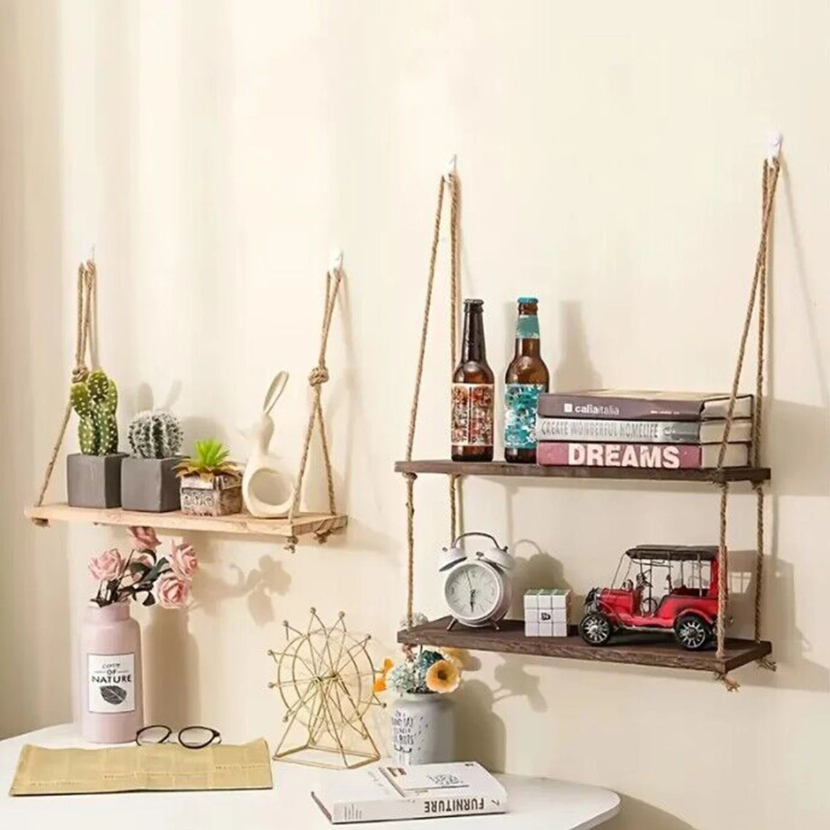 Rustic wooden hanging shelves with rope displaying various potted plants and decorative items.