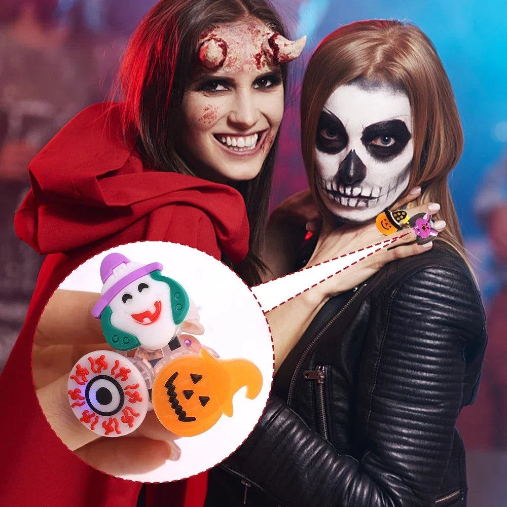 A woman holds glow-in-the-dark Halloween rings with flashing lights in front of her.