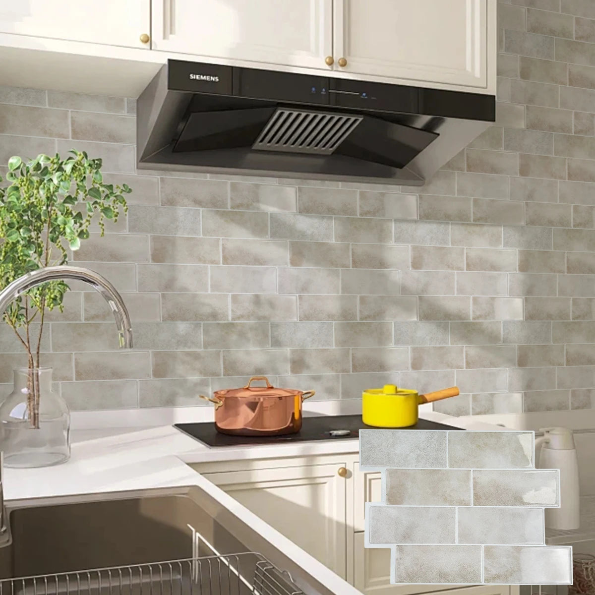 A kitchen setup featuring a Siemens range hood above a countertop with light gray subway tile backsplash and white cabinetry.