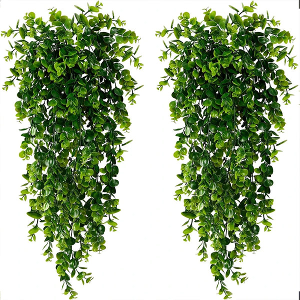 Two vertical strands of artificial eucalyptus hanging plants used for home decor