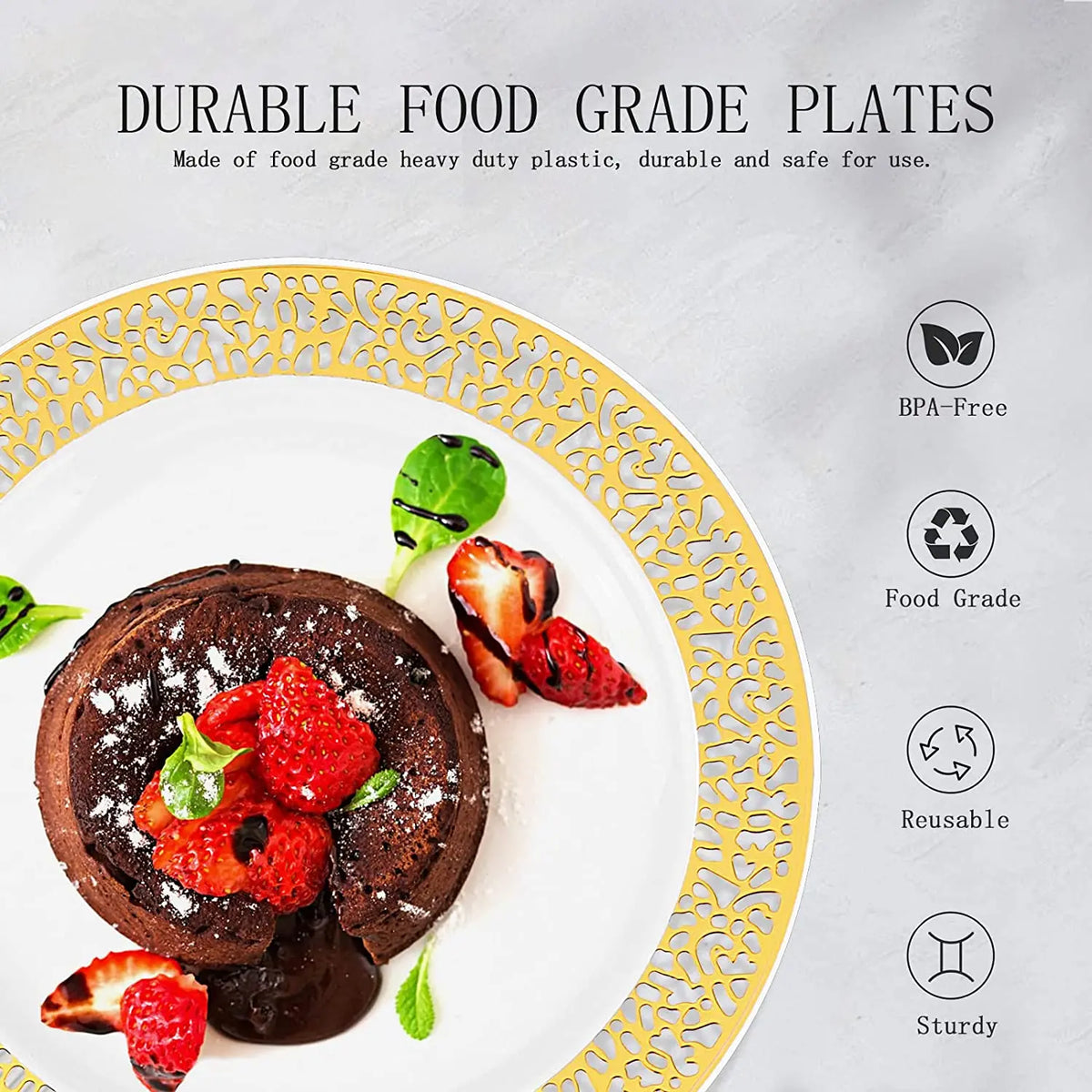 A white plate with a gold rim holds a dark chocolate pancake topped with fresh strawberries and a green leaf.
