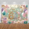 A festive birthday backdrop featuring gold, pink, and purple balloons and floral accents for a photo booth.