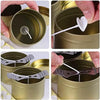 A set of gold metal candle tins with lids, showing various opening mechanisms and designs.