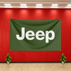 A dark green banner with the word Jeep in white lettering hangs on a red wall.