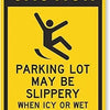 Yellow caution sign warning that a parking lot may be slippery in icy or wet conditions.