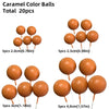 A set of 20 caramel color balls in various sizes on wooden sticks for cake decorating.