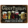 A vintage retro metal wall sign with the text GROUP THERAPY and PRACTICED HERE featuring various glasses and mugs.
