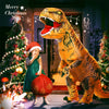 A yellow inflatable T-Rex costume standing next to a child in a Christmas setting.