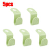Five light green space-saving hanger connector hooks for organizing and hanging items.