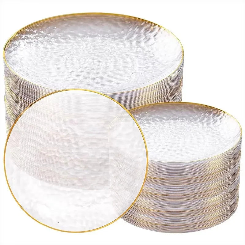 Stack of disposable dinner plates with hammered gold rims and white surfaces