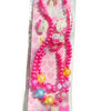 A pink beaded jewelry set featuring a cat charm and butterfly hair clip displayed in clear packaging.
