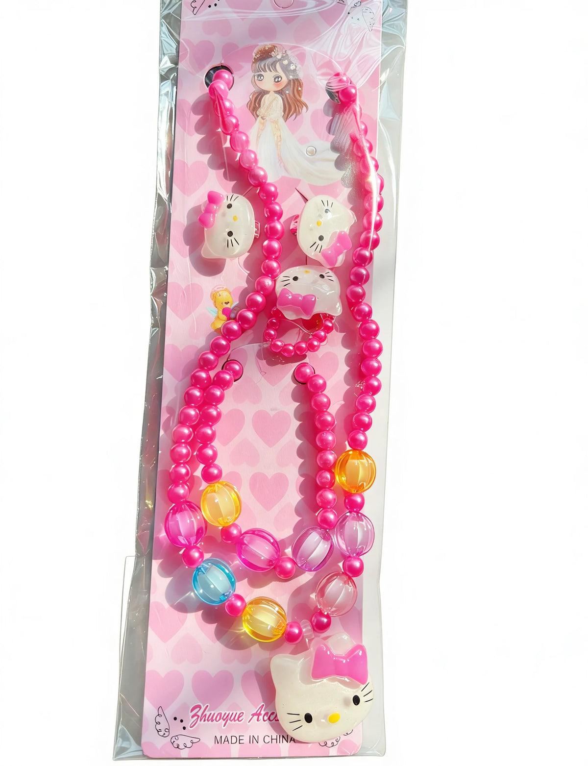 A pink beaded jewelry set featuring a cat charm and butterfly hair clip displayed in clear packaging.