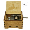 A wooden music box with a lid featuring an anime character and a silver mechanism.