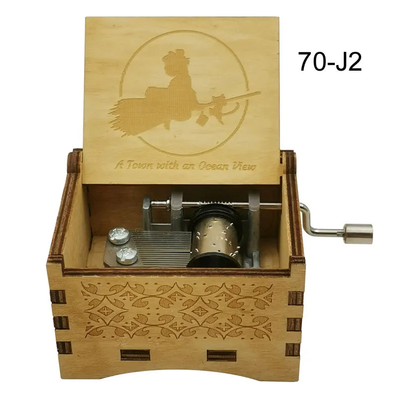 A wooden music box with a lid featuring an anime character and a silver mechanism.