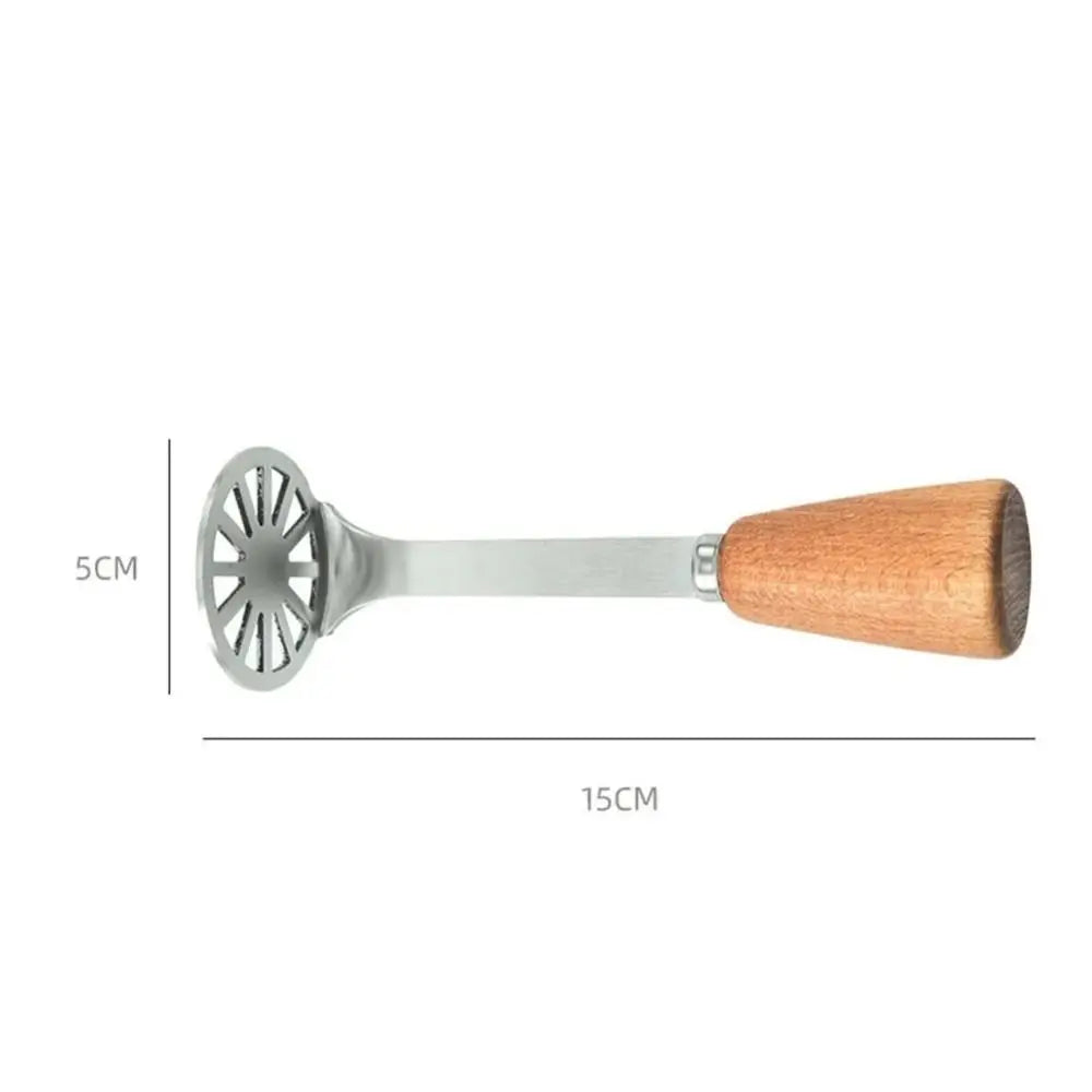 A silver manual masher with a wooden handle used for crushing potatoes and pumpkin.