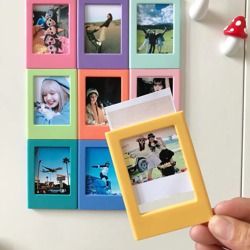 A collection of colorful magnetic photo frames featuring various people and animals.