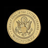 Gold-plated CIA challenge coin featuring the Great Seal of the United States and Washington, D.C.