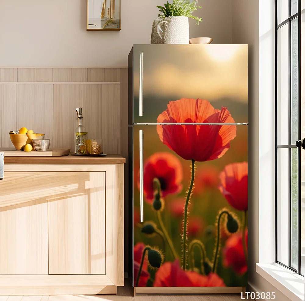A tall refrigerator with a floral decal featuring red poppies and green stems, set against a light wood cabinet.