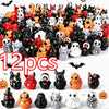 A collection of 12 mini resin Halloween duck figurines in various colors and designs for decor.