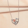 Silver pendant necklace featuring a rose and bear design on a delicate chain.