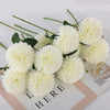 A cluster of fluffy white artificial chrysanthemum flower balls used for weddings and home decor.