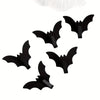 A set of five black gothic bat adhesive hooks for keys and bags.