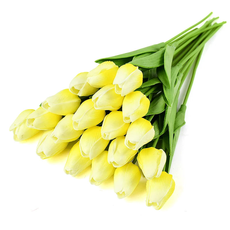 A bouquet of yellow artificial tulips on a green stem for decoration.