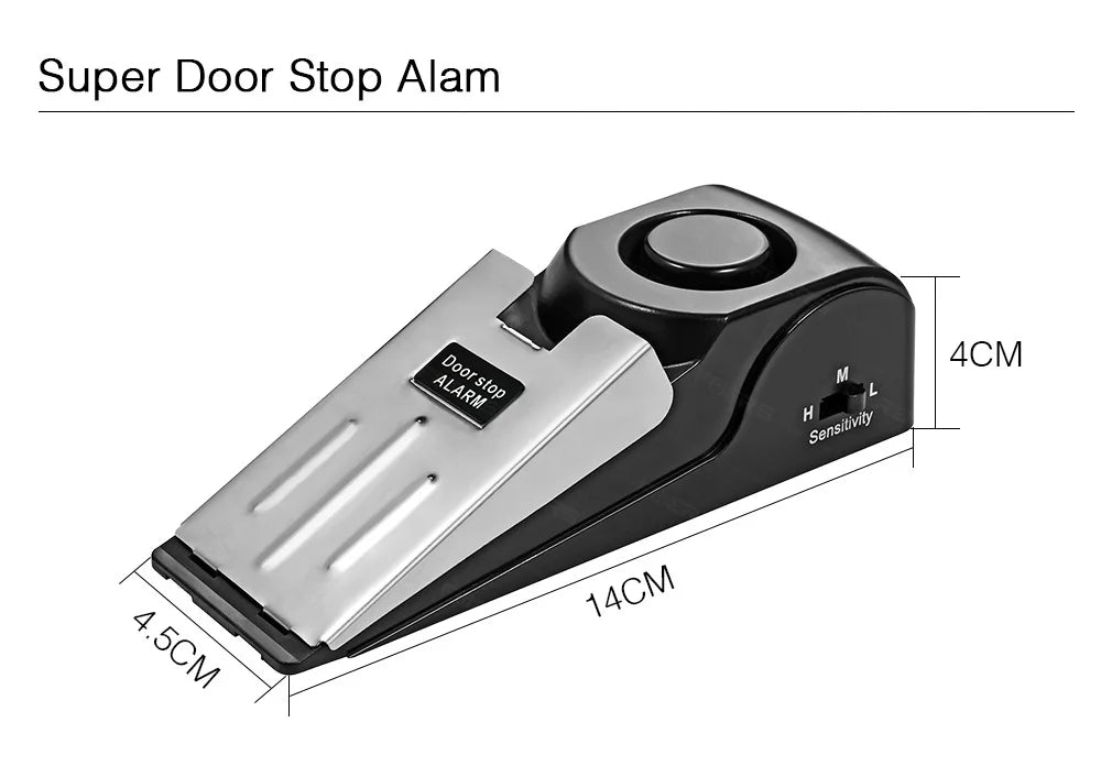 A silver door stop alarm device with a black casing and sensitivity adjustment dial.