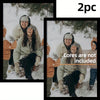 Two women bundled in winter clothing smiling while sitting in the snow