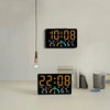 A black digital alarm clock displaying the time 10:08 and temperature 25 degrees Celsius.