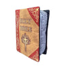A brown and red cloth book titled Holy Bible with decorative scrollwork on the cover.