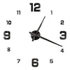 A black and silver giant acrylic wall clock face showing the numbers 1 through 12.