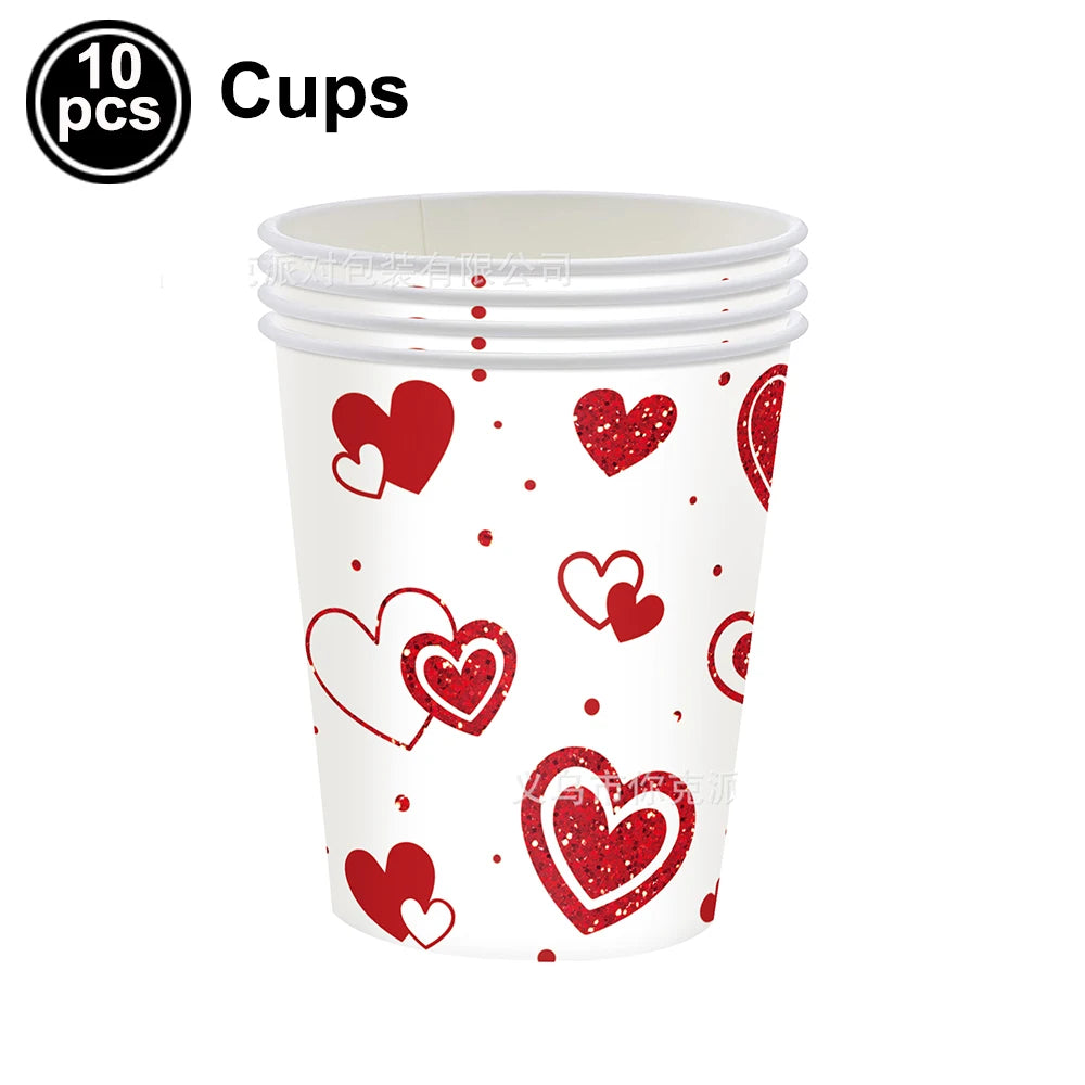 Ten cups featuring a pattern of red heart designs on white cups.