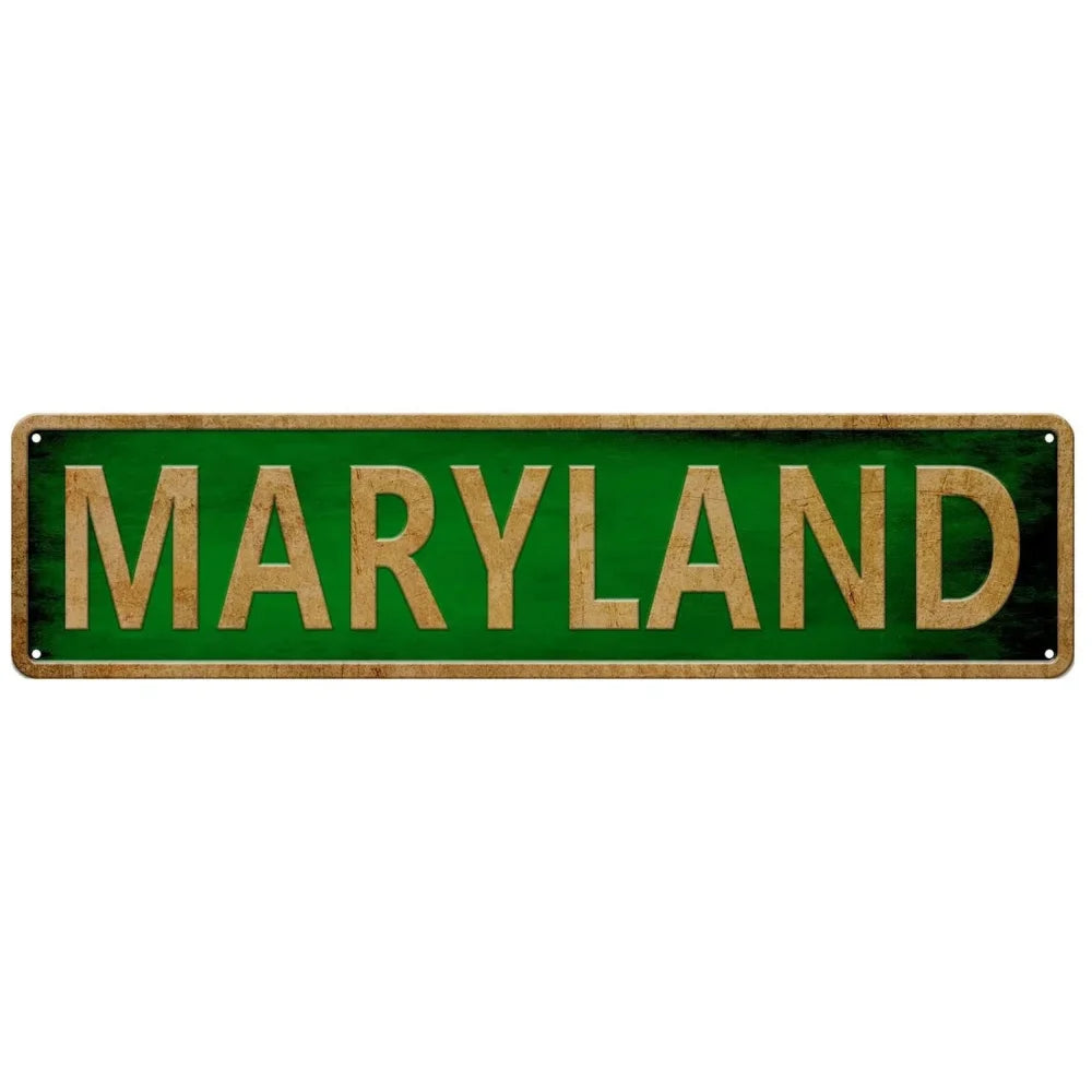 A rectangular green metal tin sign with the word MARYLAND written in gold lettering.
