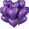 A bunch of purple heart-shaped foil balloons tied together for a celebration