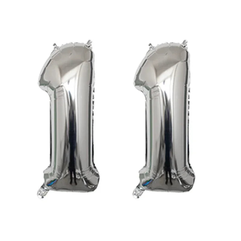 Silver helium foil number balloon shaped like the number 1