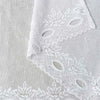 White lace mesh sheer curtain featuring decorative cutouts and a rod pocket.