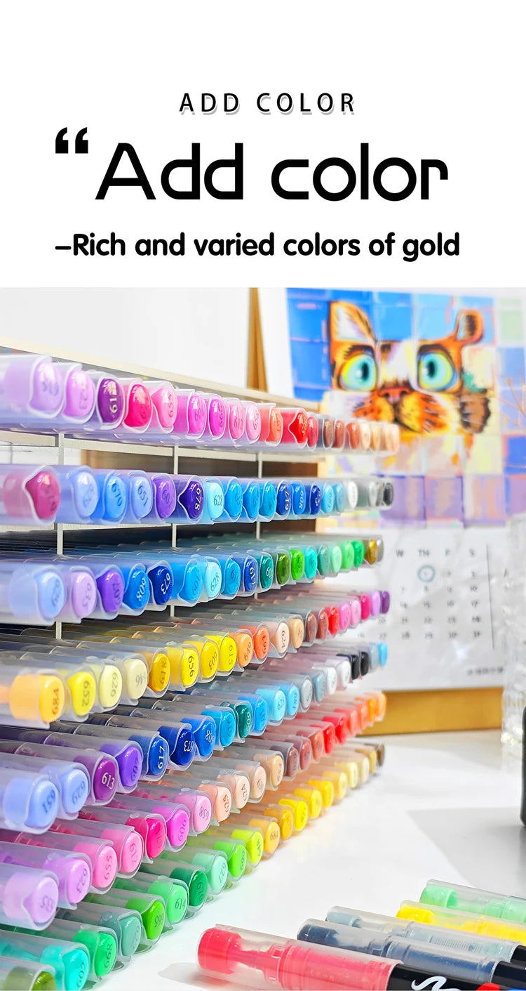 A close-up view of a set of 36 color acrylic paint markers in various shades of gold and other colors, displayed in plastic c
