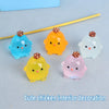 A collection of colorful luminous resin chicken car ornaments in shades of blue, orange, yellow, and pink.
