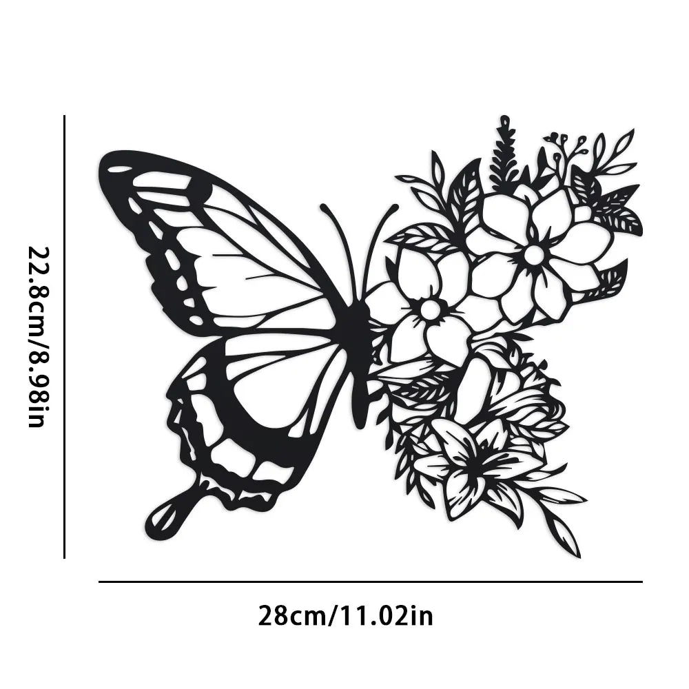 Black metal butterfly wall decor featuring a detailed floral pattern.