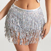Silver sequin hula dancer skirt with tassel belts worn by a model.