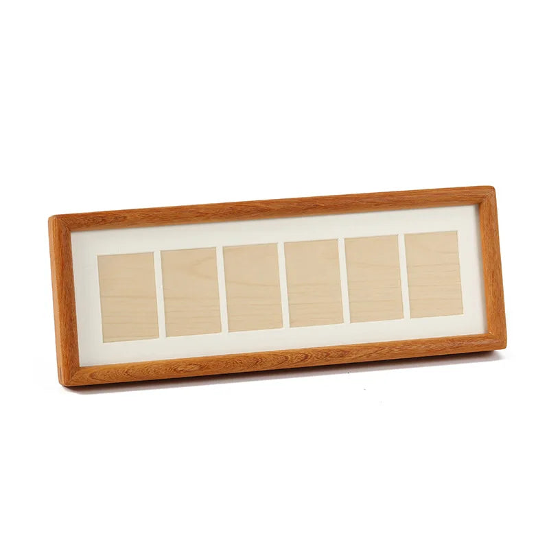 A rectangular wooden photo frame display stand with a light wood border and six individual rectangular slots.