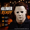 A close-up of a person wearing a pale, ghostly latex mask with dark features, promoting Halloween ready costume parties and h