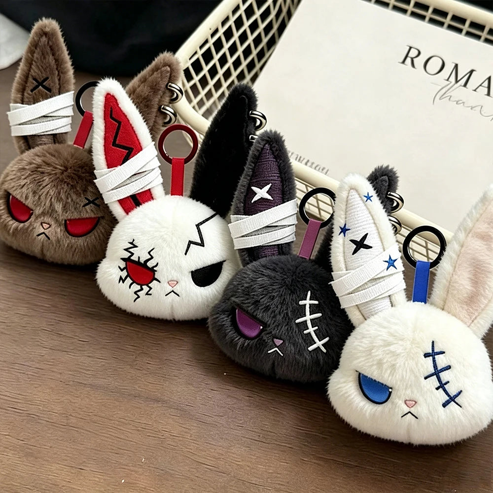 A collection of gothic bunny plush keychains featuring bandages and various dark and light fur colors.