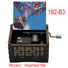 A wooden music box with a lid showing a colorful balloon display, featuring the title Music: married life.